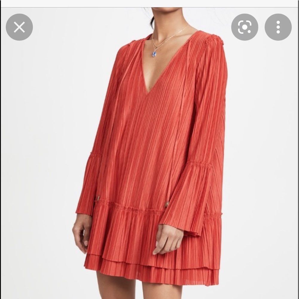 Red pleated swing dress. Free People. Never worn. Size Medium.
